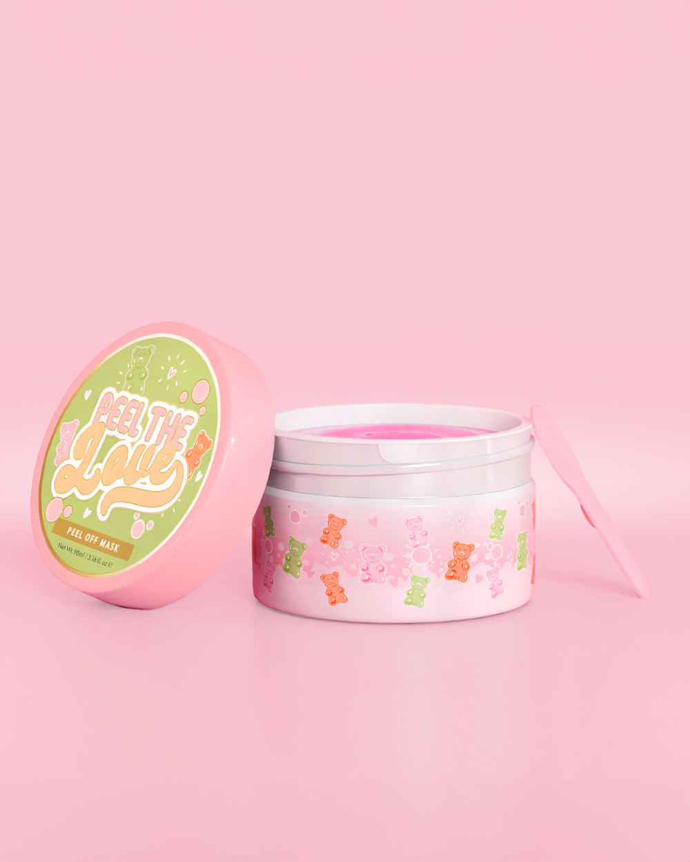 Pink beholder med candy bear design på en pink baggrund