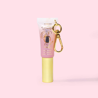 Mini tube of P.Louise Babyccino Keychain clear Eyebrow Gel on a pink background