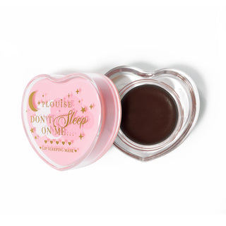 Pink heart-shaped lip sleeping mask with the lid off on a white background