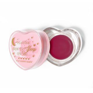 Pink heart-shaped lip sleeping mask with the lid off on a white background