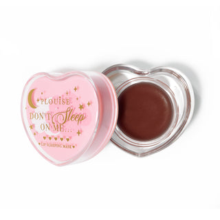 Pink heart-shaped lip sleeping mask with the lid off on a white background
