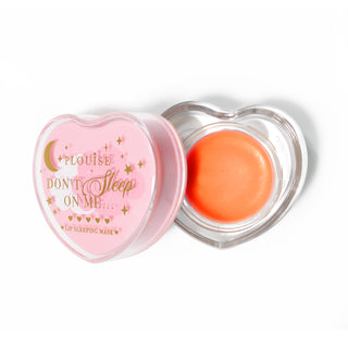Pink heart-shaped lip sleeping mask with the lid off on a white background