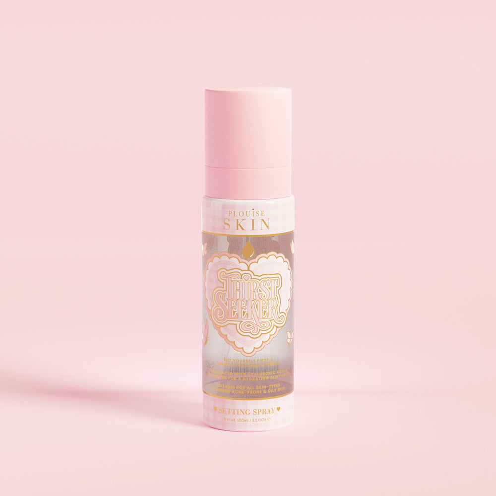 A pink spray bottle labeled 'P.Louise SKIN' with a depiction of a heart and some floral elements, containing a hydrating setting spray.